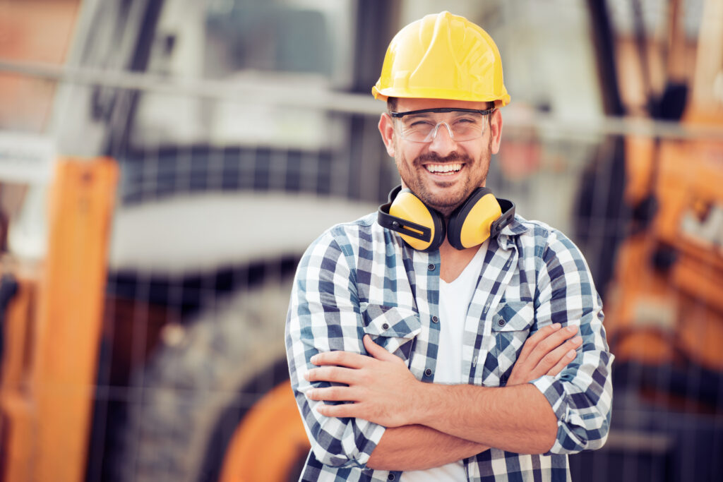 Young construction worker in hard hat Young construction worker in hard hat